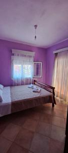 Postel nebo postele na pokoji v ubytování Villa Mitselo Apartments
