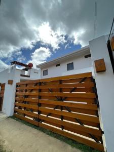 a wooden fence on the side of a house at Villa Tortuga San Juan del Sur in San Juan del Sur