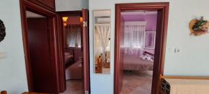 Postel nebo postele na pokoji v ubytování Villa Mitselo Apartments