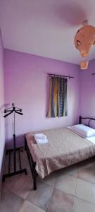 Postel nebo postele na pokoji v ubytování Villa Mitselo Apartments
