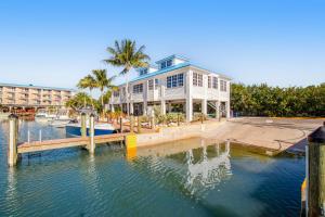 a house on the water next to a marina at Tavernier Escape #4408 in Tavernier