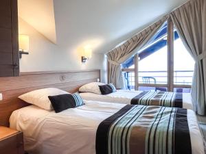 Ένα ή περισσότερα κρεβάτια σε δωμάτιο στο South facing 2-bed apartment with fireplace, Terrasses dEos +55 φωτογραφίες