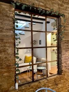 a view of a living room through a window at Preciosa villa en el corazón de Gandia in Gandía