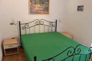 A bed or beds in a room at Casa di Giò - Bilocale con giardino