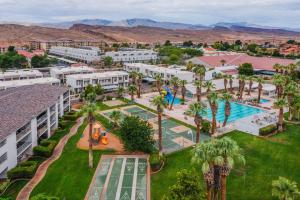 an aerial view of a resort with a pool and palm trees at 806 LP Large Family Area, Private Balcony with Gorgeous Views, and More in St. George