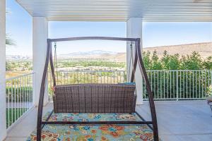 a swing on a porch with a view at 806 LP Large Family Area, Private Balcony with Gorgeous Views, and More in St. George