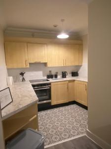 Η κουζίνα ή μικρή κουζίνα στο Foyle View Apartment +3 φωτογραφίες