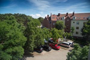 a group of cars parked in a parking lot at Apartament Słoneczny Ustka in Ustka