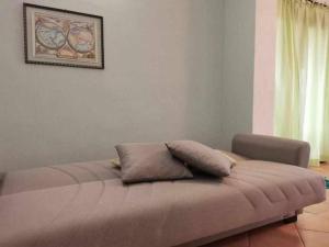 Un pat sau paturi într-o cameră la Villetta Trilocale con Giardino 1.3