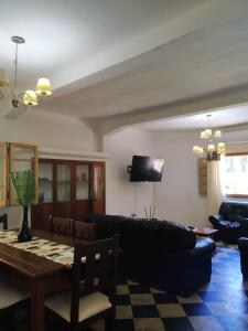 a living room with a couch and a table at Finca La Codiciada in San Rafael