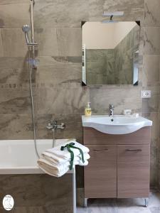 a bathroom with a shower and a sink and a tub at Casa Vacanze Donna Erminia in Calitri +66 photos