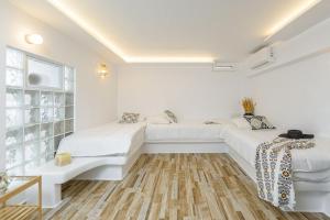 Postel nebo postele na pokoji v ubytování Naxian Nest 2BR Apart Near Beach - Semi Basement