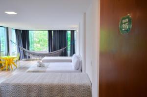 Cama ou camas em um quarto em Pousada Vie
