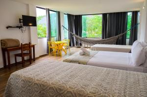 Cama ou camas em um quarto em Pousada Vie