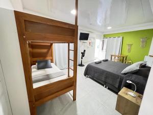 a bedroom with a bunk bed in a room at Alojamientos Neca in San Andrés