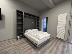 Postel nebo postele na pokoji v ubytování HH Apartments