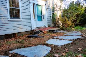a yard with stepping stones in front of a house at Long Mountain Suite in Amherst