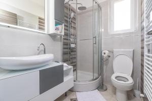 a bathroom with a toilet and a sink and a shower at Apartments with parking space Punat, Krk - 20553 in Punat +26 photos