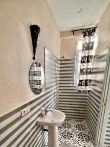 a bathroom with a sink and a shower at Riad Allal in Marrakech