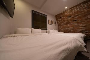 Postel nebo postele na pokoji v ubytování No25 Hotel Yeonsan