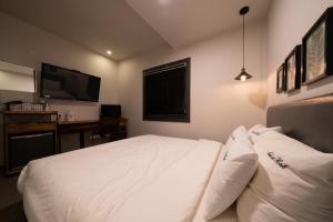 Postel nebo postele na pokoji v ubytování No25 Hotel Yeonsan
