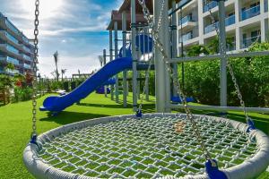 a playground with a slide in a park at Apartamento vista al Mar lateral Panoramic View,Spectacular building,Pools, Beach Morros zoe ultimo piso in Cartagena de Indias