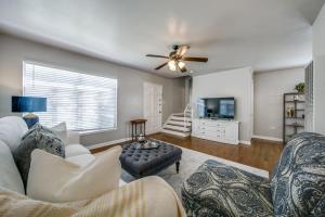 a living room with a couch and a ceiling fan at Historical Home in Iconic Alamo Heights - Sky view in San Antonio