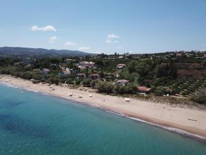 an aerial view of a beach with boats in the water at Anastassia EG in Koroni +29 photos
