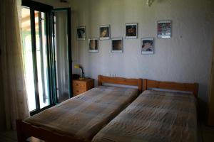 A bed or beds in a room at Dionisios