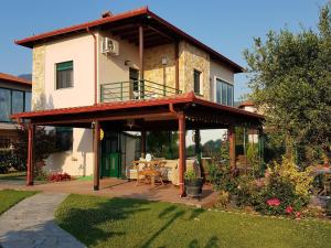 a house with a deck with a patio at Iliana in Skotína