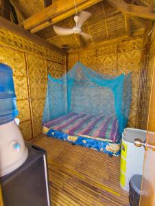 a small bed in a room with a ceiling at Truth be Found Ministry Resort in Jagna