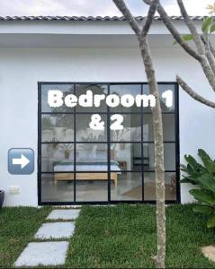 a store window with a bedowment sign on it at Allure Villa Cempaka Private Pool in Kuantan