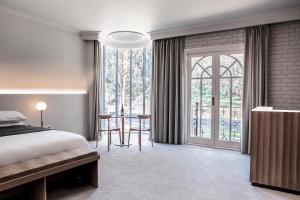 a bedroom with a bed and a large window at Trawool Estate in Trawool +52 photos
