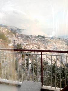a view of a city from a balcony at Green view Guest House in Murree