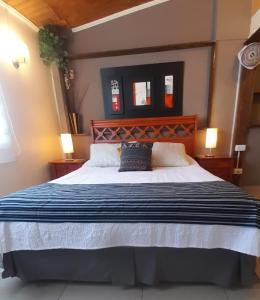 Postel nebo postele na pokoji v ubytování Hostal del Aguila