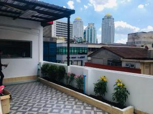 a balcony with a view of a city skyline at Miracle Gallery Hotel in Makkasan