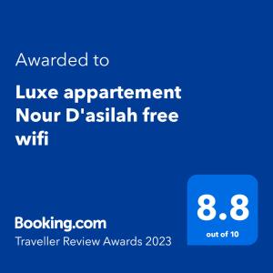 a blue screen with the text awarded tolik apartment north dakak free wifi at Luxe appartement Nour D'asilah free wifi 5G in Asilah