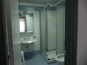 a bathroom with a shower and a sink and a toilet at San Domenico Hotel in Soverato Marina +134 photos
