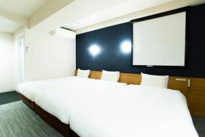 Postel nebo postele na pokoji v ubytování Hotel Meldia Kyotoshijoomiya