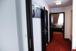 Letto o letti in una camera di Pension Dvořák