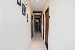 a corridor of a hallway with at FabExpress Emerald Inn in Mumbai