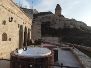 a bath tub in the middle of a building at Secret Hill Cave Suites in Göreme