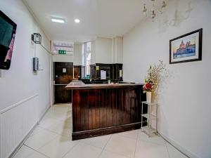 a large kitchen with a counter in a room at Weaste Hotel, West Manchester in Manchester