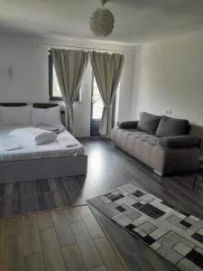 Giường trong phòng chung tại Apartamente Ambrus E Studio 21 Praid
