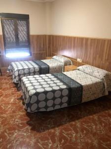 Voodi või voodid majutusasutuse Hotel Manises toas