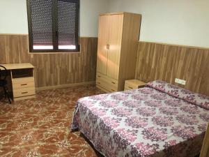 Voodi või voodid majutusasutuse Hotel Manises toas