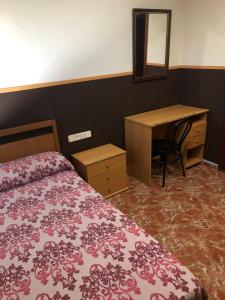 Voodi või voodid majutusasutuse Hotel Manises toas