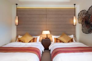 Postel nebo postele na pokoji v ubytování Ocean Front Villa Ishigakijima Ⅰ