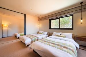 Ένα ή περισσότερα κρεβάτια σε δωμάτιο στο Ocean Front Villa Ishigakijima Ⅰ +40 φωτογραφίες