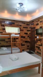Postel nebo postele na pokoji v ubytování Woodland Inn